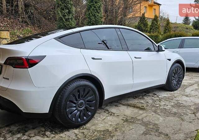Белый Тесла Model Y, объемом двигателя 0 л и пробегом 99 тыс. км за 20000 $, фото 2 на Automoto.ua