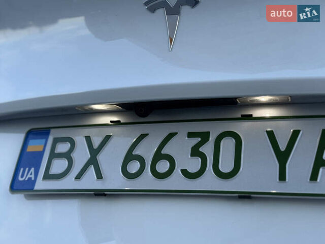 Тесла Model Y 2021 в Хмельницком на Automoto.ua Белый Тесла Model Y, объемом двигателя 0 л и пробегом 83 тыс. км за 25499 $, фото 32 на Automoto.ua