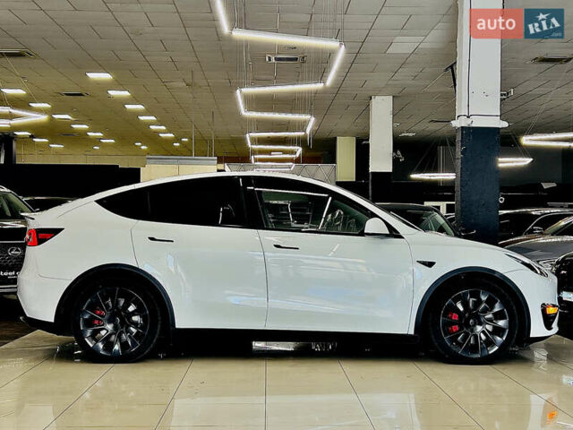Білий Тесла Model Y, об'ємом двигуна 0 л та пробігом 74 тис. км за 24979 $, фото 3 на Automoto.ua