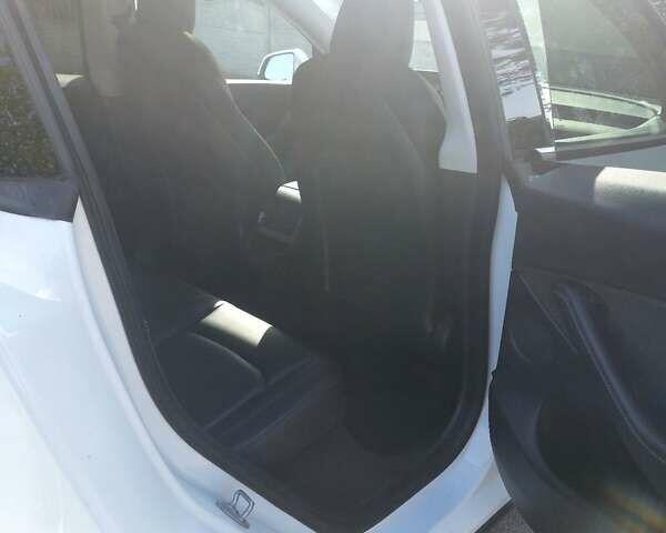 Белый Тесла Model Y, объемом двигателя 0 л и пробегом 58 тыс. км за 23400 $, фото 1 на Automoto.ua