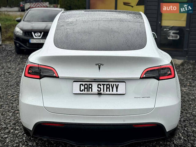 Білий Тесла Model Y, об'ємом двигуна 0 л та пробігом 62 тис. км за 27400 $, фото 59 на Automoto.ua