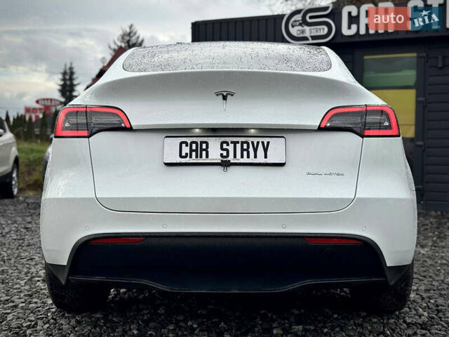 Білий Тесла Model Y, об'ємом двигуна 0 л та пробігом 62 тис. км за 27400 $, фото 60 на Automoto.ua