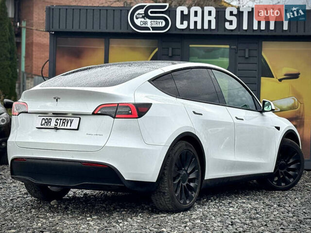 Білий Тесла Model Y, об'ємом двигуна 0 л та пробігом 62 тис. км за 27400 $, фото 48 на Automoto.ua