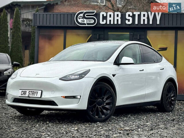 Білий Тесла Model Y, об'ємом двигуна 0 л та пробігом 62 тис. км за 27400 $, фото 1 на Automoto.ua