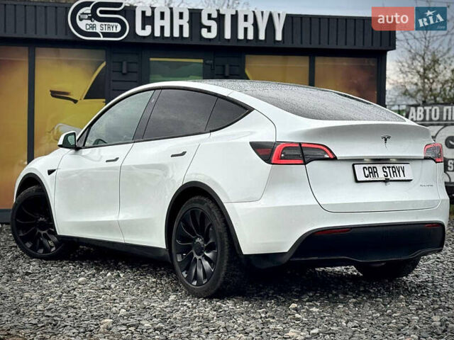 Білий Тесла Model Y, об'ємом двигуна 0 л та пробігом 62 тис. км за 27400 $, фото 54 на Automoto.ua