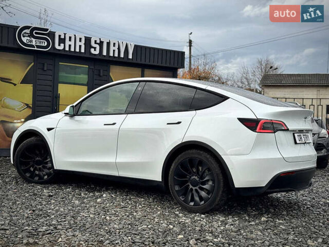 Білий Тесла Model Y, об'ємом двигуна 0 л та пробігом 62 тис. км за 27400 $, фото 57 на Automoto.ua
