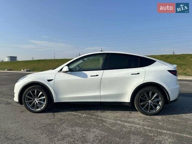 Білий Тесла Model Y, об'ємом двигуна 0 л та пробігом 61 тис. км за 22300 $, фото 2 на Automoto.ua