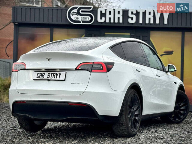 Білий Тесла Model Y, об'ємом двигуна 0 л та пробігом 62 тис. км за 27400 $, фото 49 на Automoto.ua