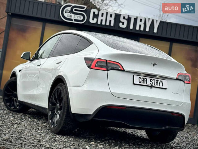 Білий Тесла Model Y, об'ємом двигуна 0 л та пробігом 62 тис. км за 27400 $, фото 56 на Automoto.ua