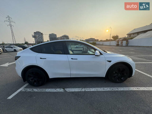 Белый Тесла Model Y, объемом двигателя 0 л и пробегом 79 тыс. км за 28000 $, фото 1 на Automoto.ua