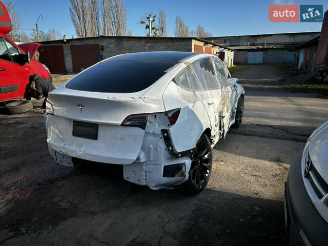 Белый Тесла Model Y, объемом двигателя 1.87 л и пробегом 64 тыс. км за 15500 $, фото 11 на Automoto.ua