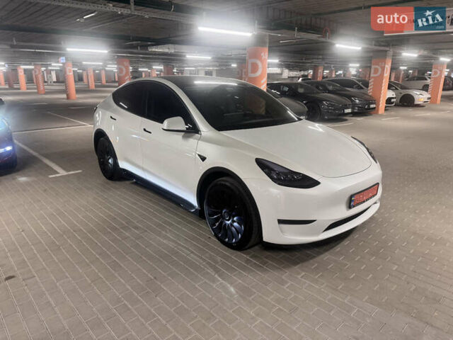 Белый Тесла Model Y, объемом двигателя 0 л и пробегом 87 тыс. км за 28999 $, фото 1 на Automoto.ua