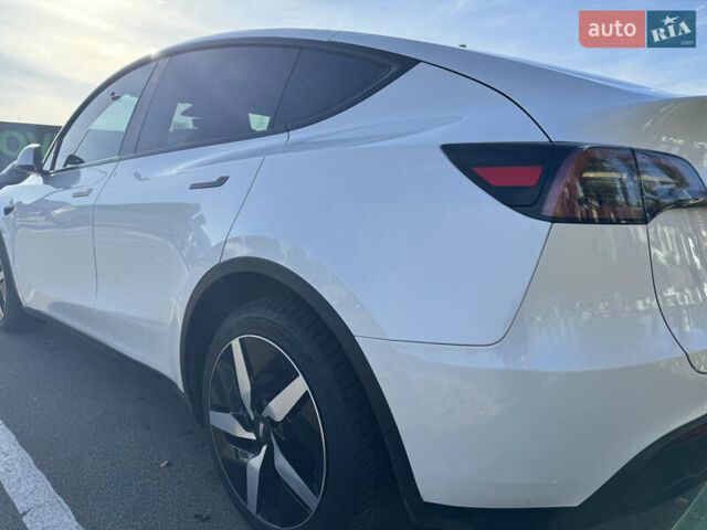 Белый Тесла Model Y, объемом двигателя 0 л и пробегом 76 тыс. км за 33000 $, фото 4 на Automoto.ua