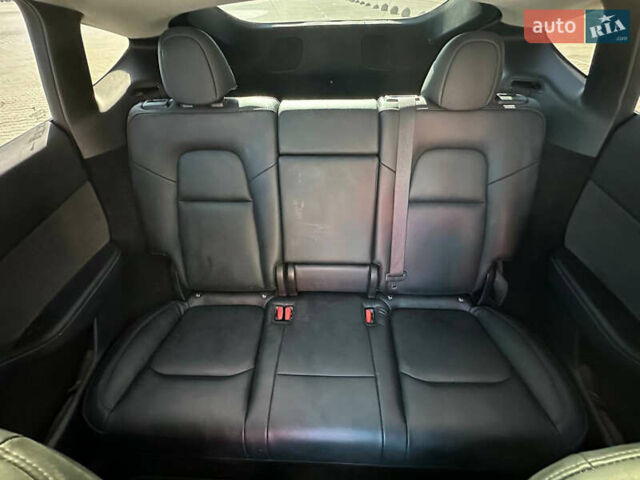 Білий Тесла Model Y, об'ємом двигуна 0 л та пробігом 53 тис. км за 25900 $, фото 18 на Automoto.ua