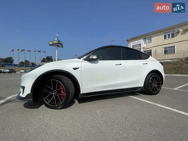 Білий Тесла Model Y, об'ємом двигуна 0 л та пробігом 75 тис. км за 33500 $, фото 1 на Automoto.ua