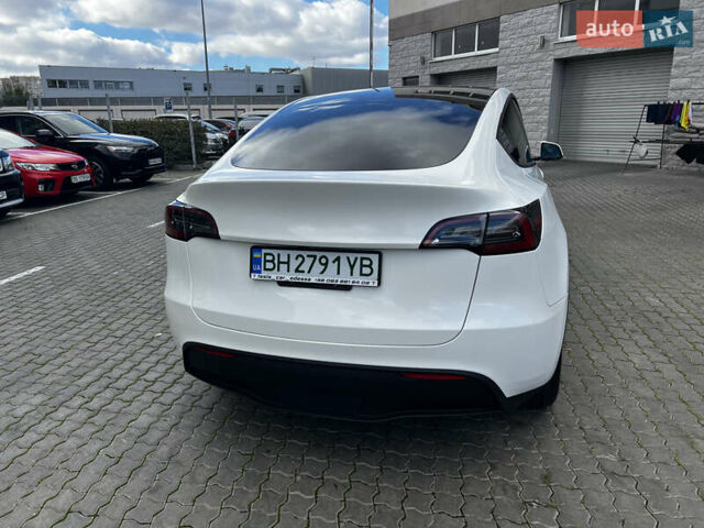 Белый Тесла Model Y, объемом двигателя 0 л и пробегом 98 тыс. км за 28000 $, фото 7 на Automoto.ua