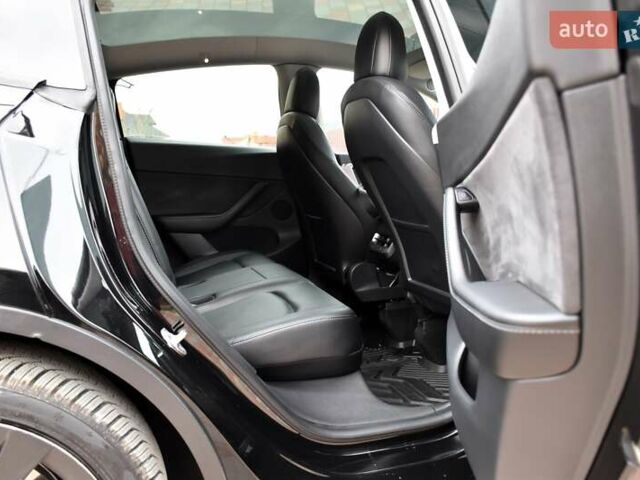 Черный Тесла Model Y, объемом двигателя 0 л и пробегом 73 тыс. км за 25950 $, фото 56 на Automoto.ua