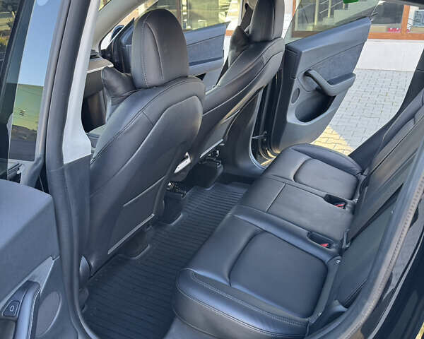 Черный Тесла Model Y, объемом двигателя 0 л и пробегом 54 тыс. км за 25900 $, фото 29 на Automoto.ua