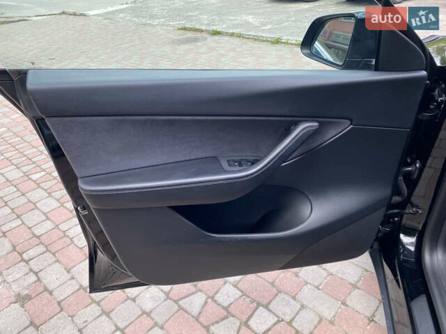 Черный Тесла Model Y, объемом двигателя 0 л и пробегом 74 тыс. км за 27699 $, фото 19 на Automoto.ua