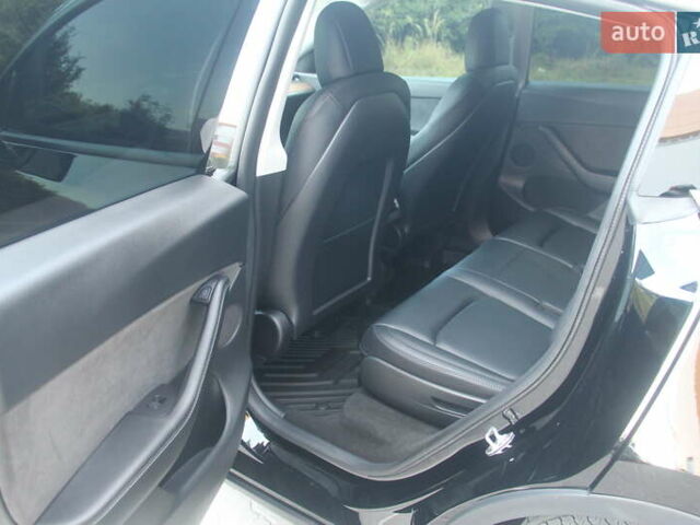 Черный Тесла Model Y, объемом двигателя 0 л и пробегом 56 тыс. км за 27499 $, фото 15 на Automoto.ua