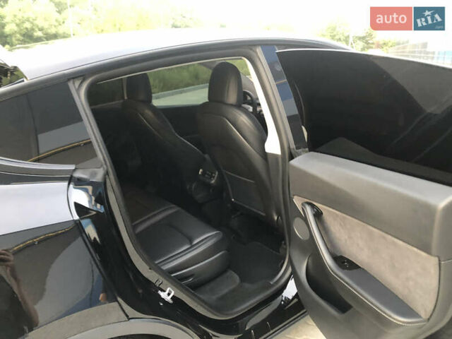 Черный Тесла Model Y, объемом двигателя 0 л и пробегом 63 тыс. км за 27500 $, фото 27 на Automoto.ua