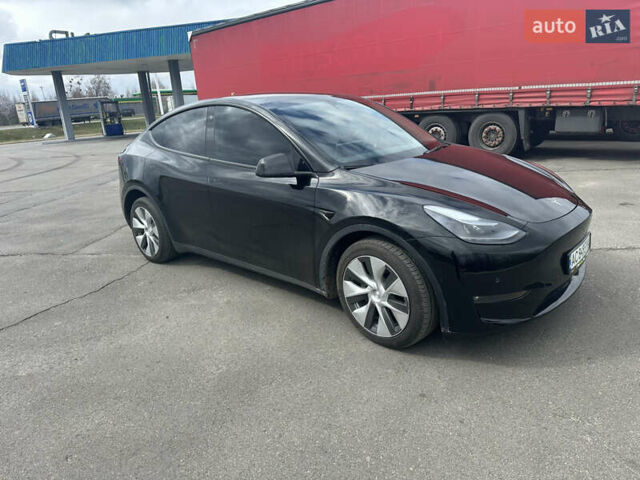 Черный Тесла Model Y, объемом двигателя 0 л и пробегом 24 тыс. км за 27999 $, фото 2 на Automoto.ua