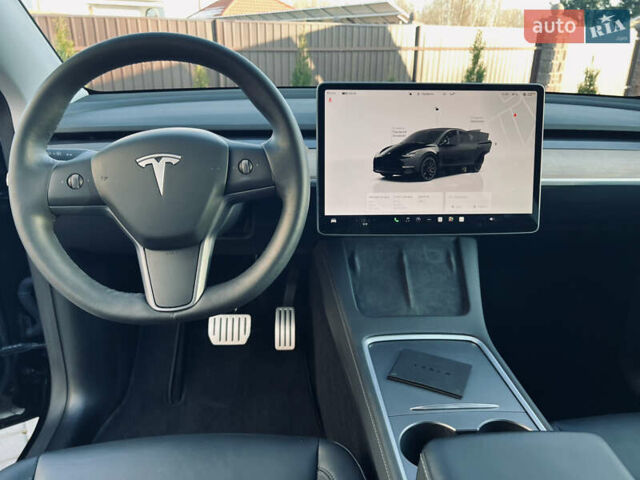 Черный Тесла Model Y, объемом двигателя 0 л и пробегом 100 тыс. км за 28900 $, фото 35 на Automoto.ua