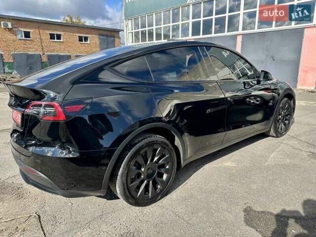 Черный Тесла Model Y, объемом двигателя 0 л и пробегом 49 тыс. км за 27555 $, фото 1 на Automoto.ua