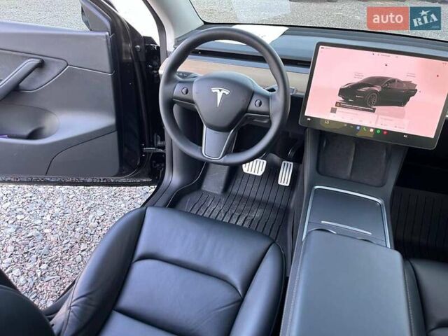 Черный Тесла Model Y, объемом двигателя 0 л и пробегом 73 тыс. км за 27890 $, фото 31 на Automoto.ua