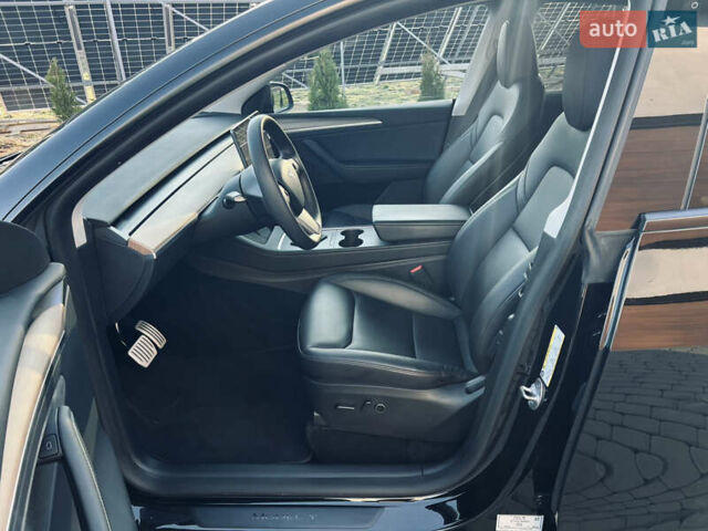 Черный Тесла Model Y, объемом двигателя 0 л и пробегом 100 тыс. км за 28900 $, фото 31 на Automoto.ua