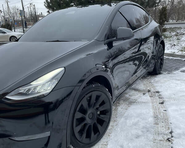 Черный Тесла Model Y, объемом двигателя 0 л и пробегом 56 тыс. км за 26999 $, фото 4 на Automoto.ua