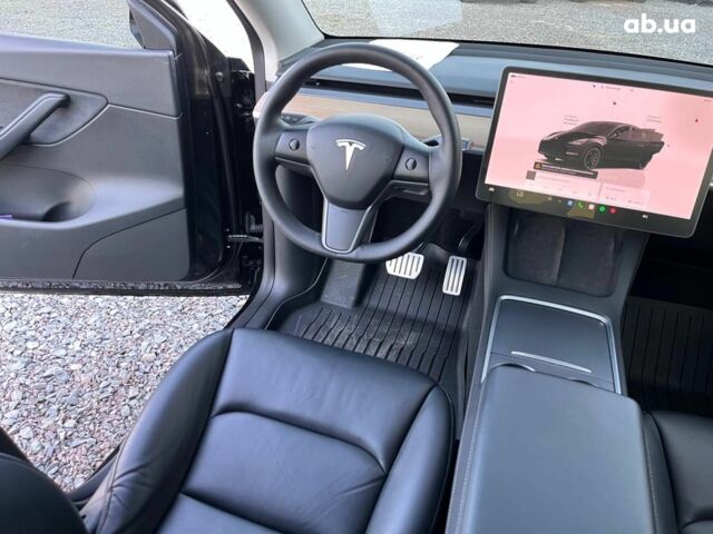 Черный Тесла Model Y, объемом двигателя 0 л и пробегом 73 тыс. км за 27890 $, фото 31 на Automoto.ua