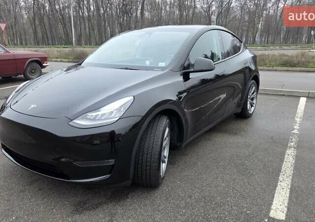 Черный Тесла Model Y, объемом двигателя 0 л и пробегом 49 тыс. км за 28900 $, фото 1 на Automoto.ua