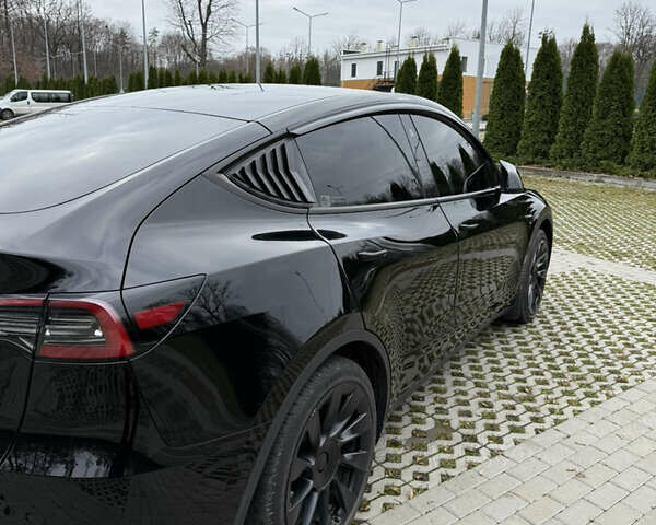 Черный Тесла Model Y, объемом двигателя 0 л и пробегом 80 тыс. км за 28000 $, фото 2 на Automoto.ua
