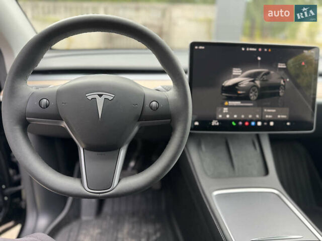 Черный Тесла Model Y, объемом двигателя 0 л и пробегом 2 тыс. км за 38300 $, фото 26 на Automoto.ua