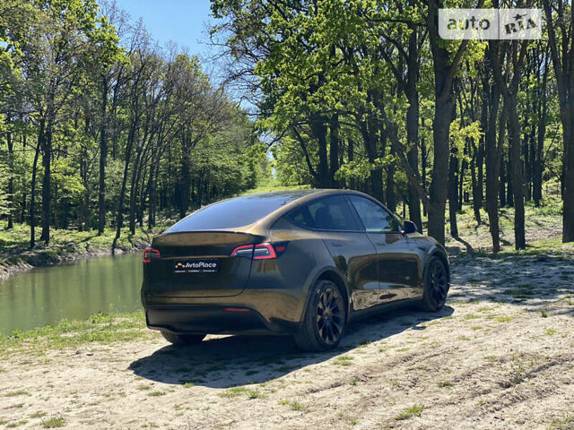 Коричневый Тесла Model Y, объемом двигателя 0 л и пробегом 66 тыс. км за 29999 $, фото 4 на Automoto.ua