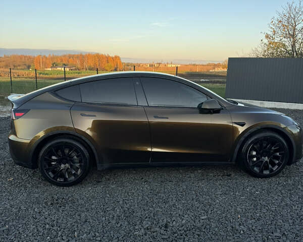 Коричневый Тесла Model Y, объемом двигателя 0 л и пробегом 84 тыс. км за 24990 $, фото 4 на Automoto.ua