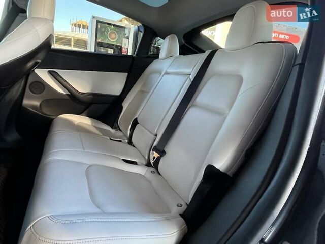 Серый Тесла Model Y, объемом двигателя 0 л и пробегом 81 тыс. км за 22099 $, фото 17 на Automoto.ua