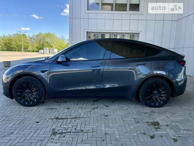 Серый Тесла Model Y, объемом двигателя 0 л и пробегом 57 тыс. км за 32900 $, фото 2 на Automoto.ua