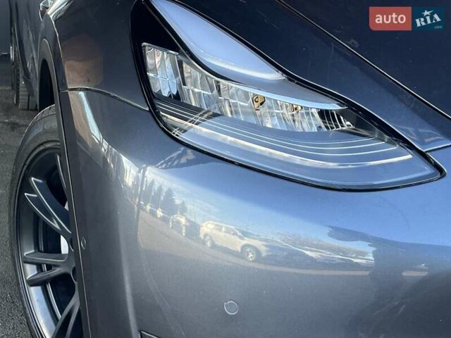 Серый Тесла Model Y, объемом двигателя 0 л и пробегом 81 тыс. км за 22099 $, фото 3 на Automoto.ua