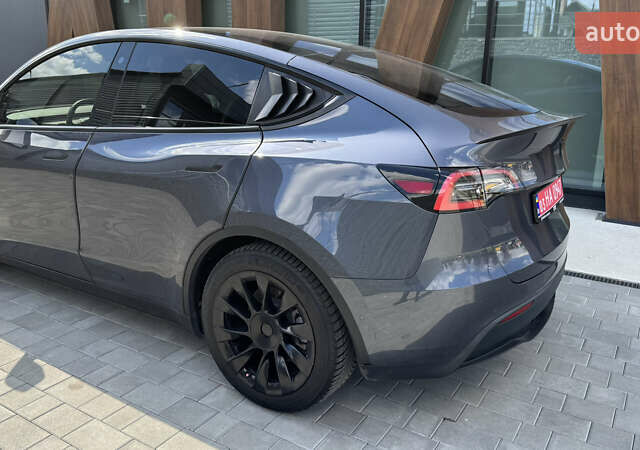 Серый Тесла Model Y, объемом двигателя 0 л и пробегом 80 тыс. км за 21500 $, фото 5 на Automoto.ua