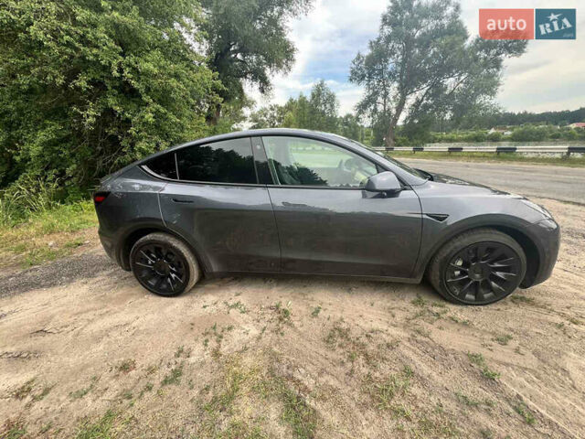 Серый Тесла Model Y, объемом двигателя 0 л и пробегом 61 тыс. км за 29000 $, фото 1 на Automoto.ua