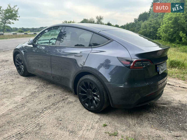 Серый Тесла Model Y, объемом двигателя 0 л и пробегом 61 тыс. км за 29000 $, фото 2 на Automoto.ua