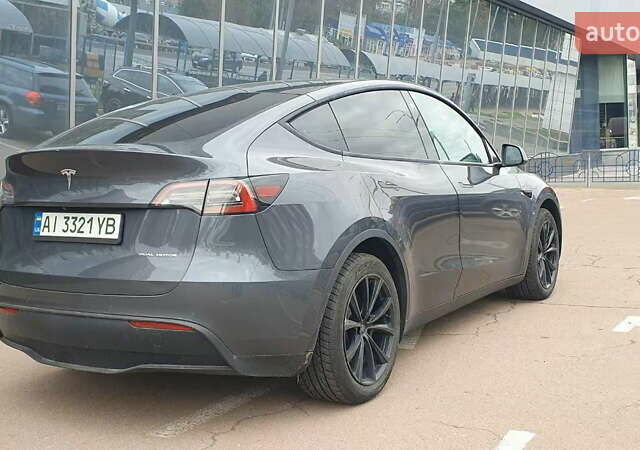 Серый Тесла Model Y, объемом двигателя 0 л и пробегом 84 тыс. км за 24999 $, фото 7 на Automoto.ua