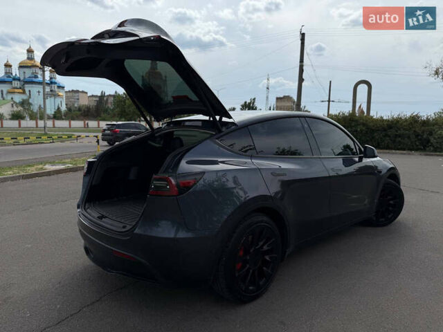 Серый Тесла Model Y, объемом двигателя 0 л и пробегом 91 тыс. км за 26500 $, фото 26 на Automoto.ua