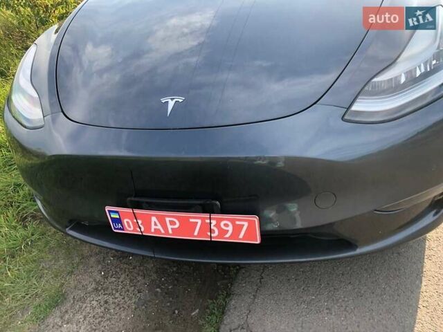 Серый Тесла Model Y, объемом двигателя 0 л и пробегом 77 тыс. км за 22700 $, фото 5 на Automoto.ua