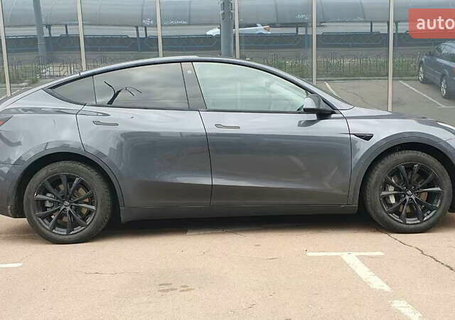 Серый Тесла Model Y, объемом двигателя 0 л и пробегом 84 тыс. км за 24999 $, фото 6 на Automoto.ua