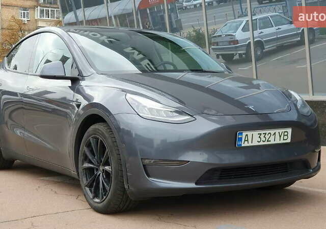 Серый Тесла Model Y, объемом двигателя 0 л и пробегом 84 тыс. км за 24999 $, фото 1 на Automoto.ua