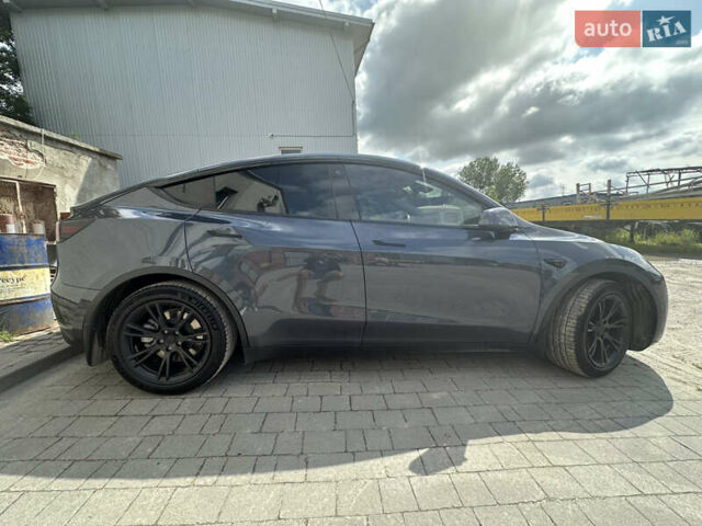 Серый Тесла Model Y, объемом двигателя 0 л и пробегом 55 тыс. км за 29000 $, фото 3 на Automoto.ua