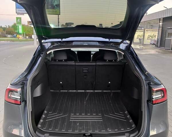 Серый Тесла Model Y, объемом двигателя 0 л и пробегом 74 тыс. км за 26999 $, фото 10 на Automoto.ua